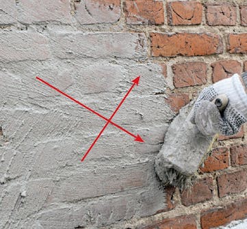 Tiiliseinän rappaus: Laasti levitetään suoraan kostutet-tuun seinään Tiiliseinän rappaus: Laasti levitetään suoraan kostutet-tuun seinään